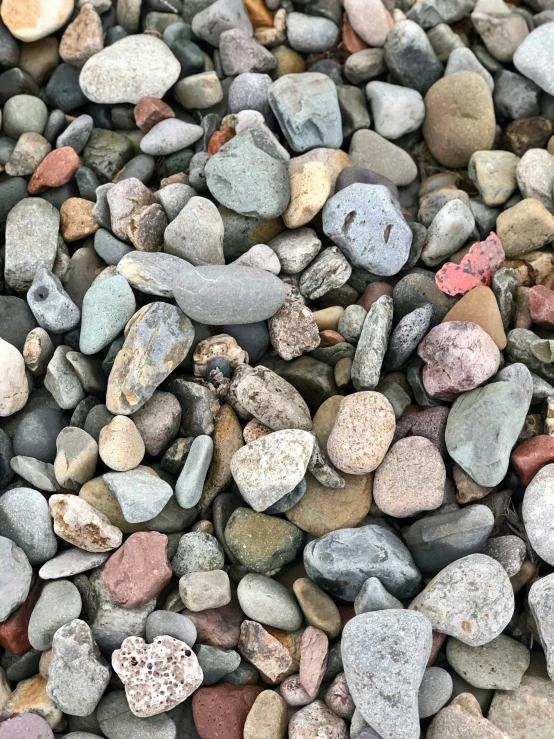 pebbles are piled up next to each other on the ground