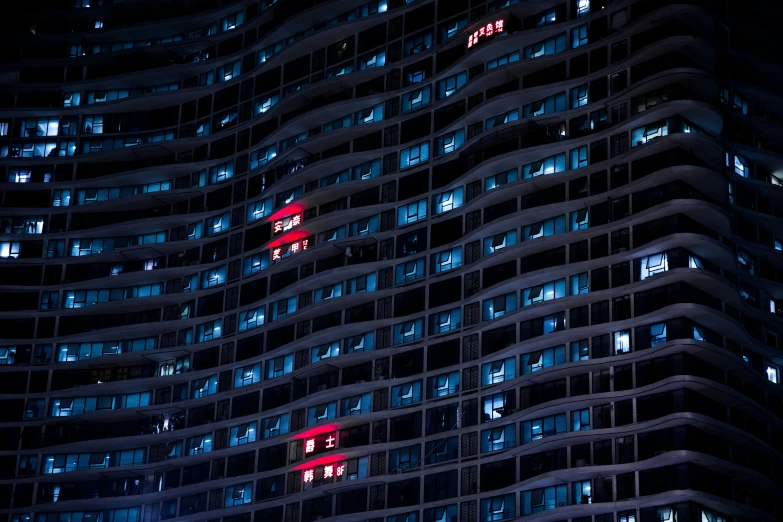 an image of night time scene of buildings that look like skyscrs