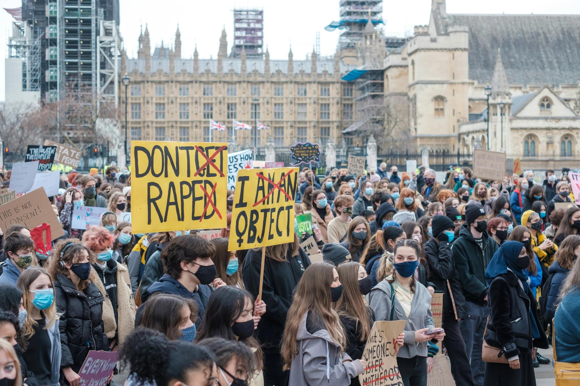 there is people holding signs in the street