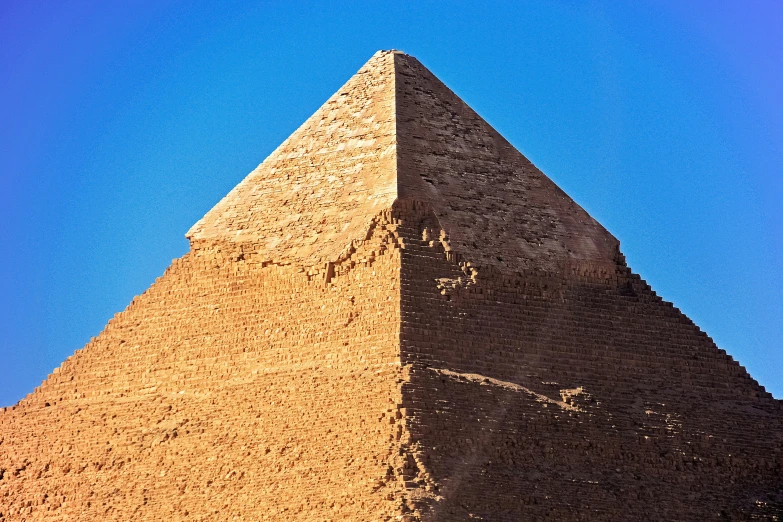 an image of a pyramid that is in the desert