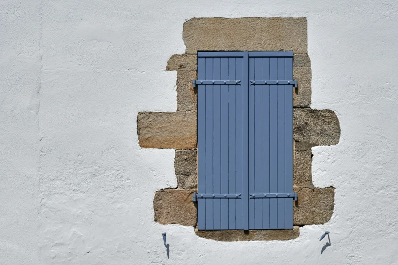 an aerial view of a blue door on the side of a building