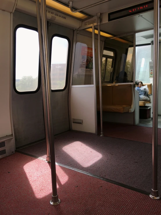 a train car with the door opened and a window open