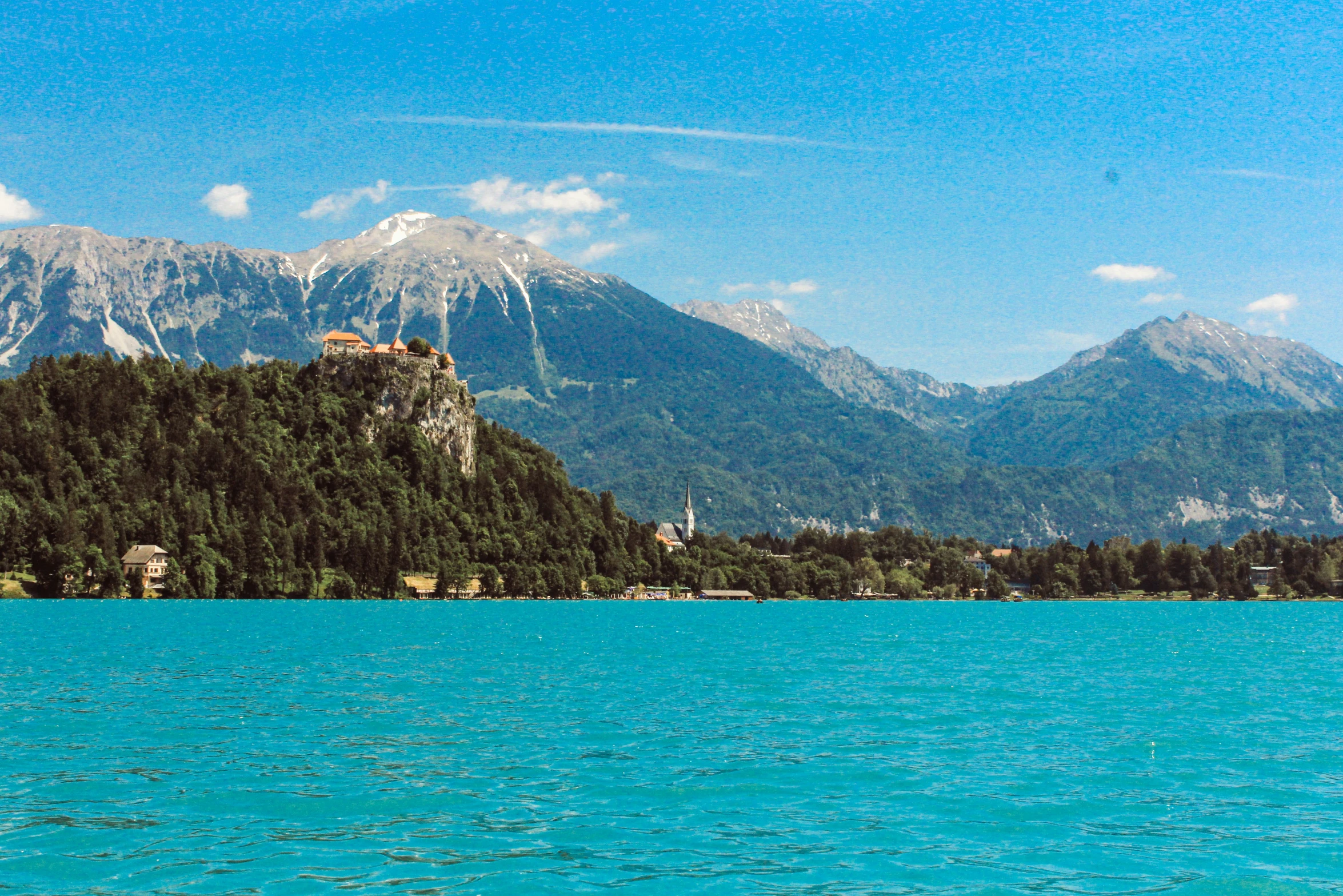 the scenic mountain landscape is surrounded by water