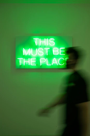 a green neon sign with an i love you message