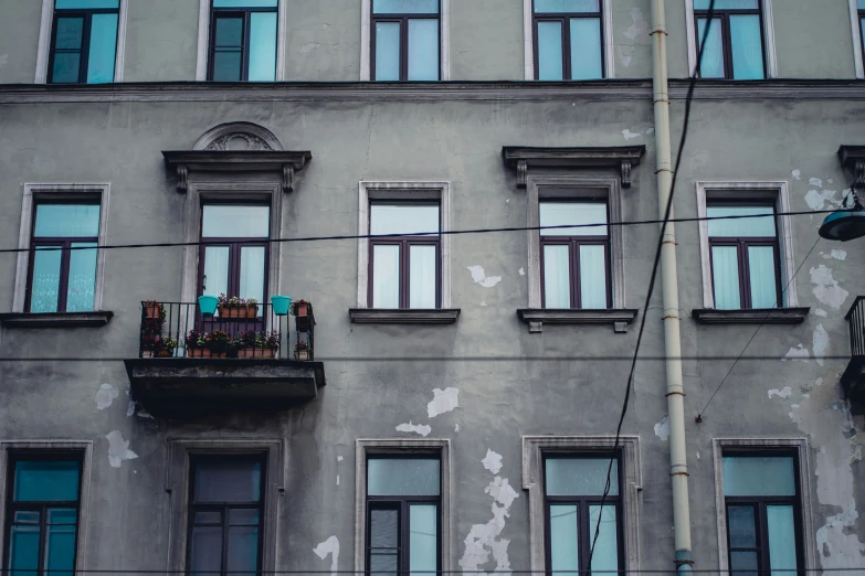 an apartment building with several windows and a balconie