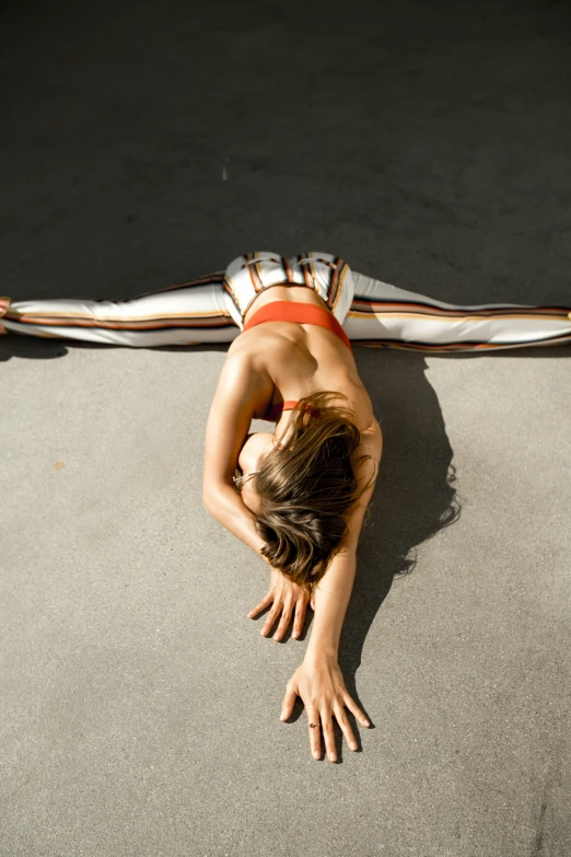 a woman with one arm in the air and holding a skateboard in the other