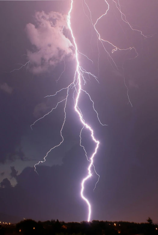 some lightning is hitting on the horizon and clouds