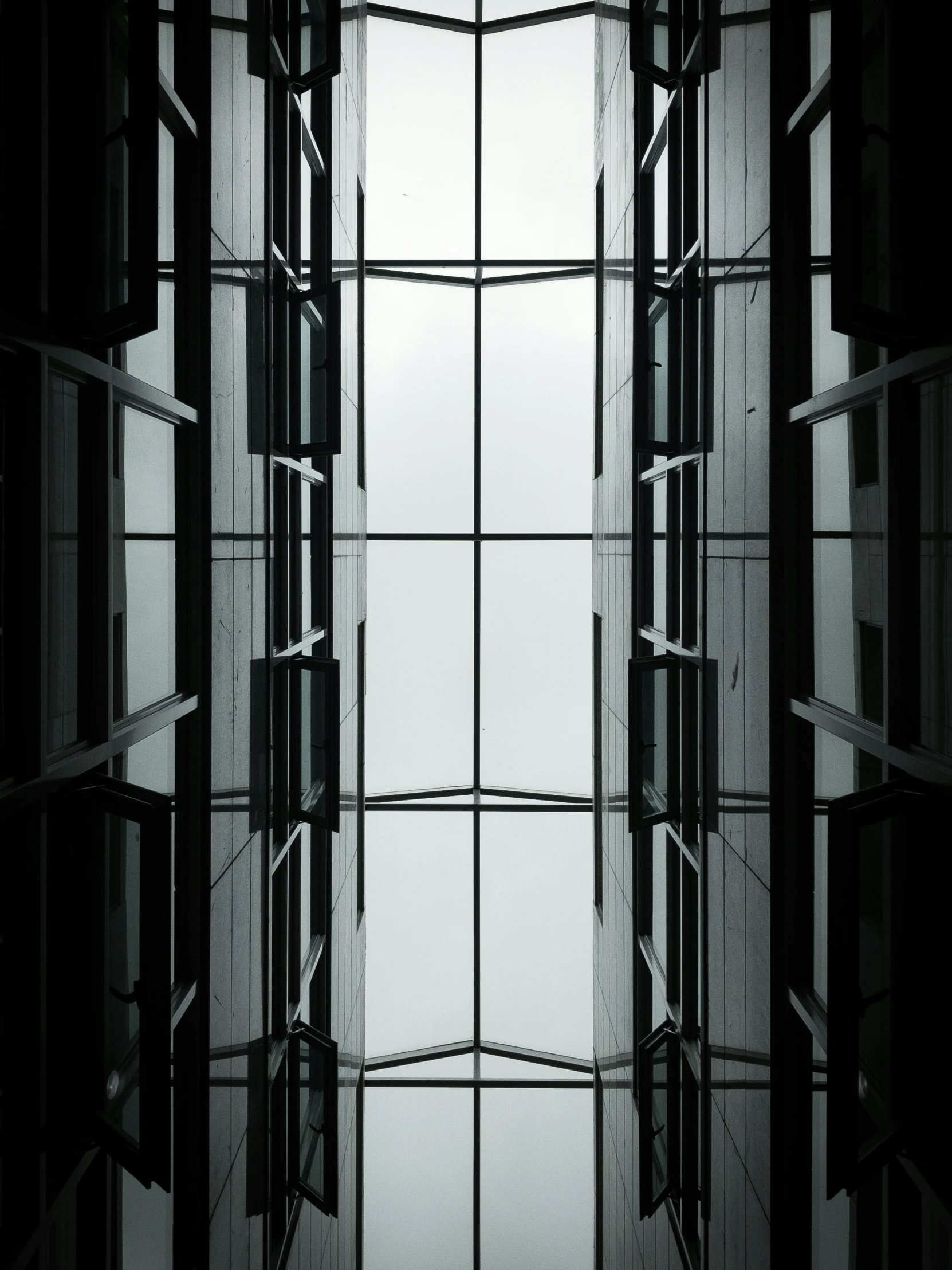 an image of a tall building taken through glass