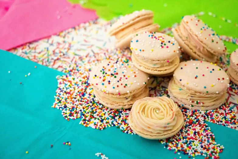 a pile of cookies with sprinkles all over them