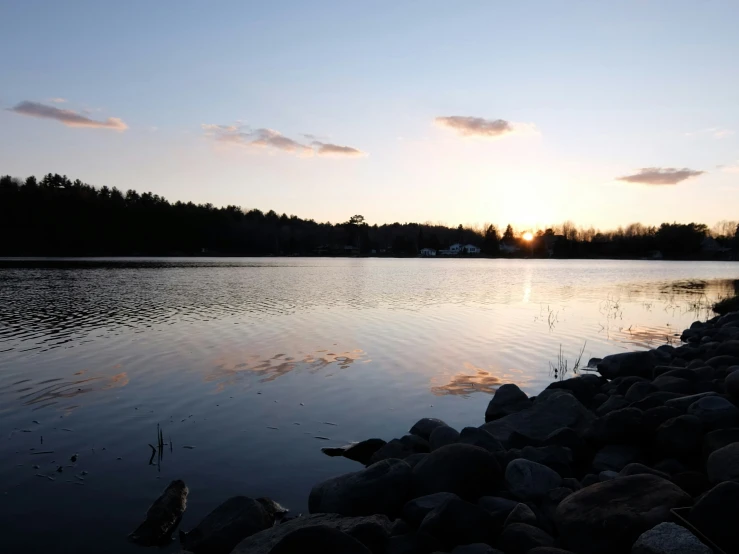 a lake with lots of rocks and water in it