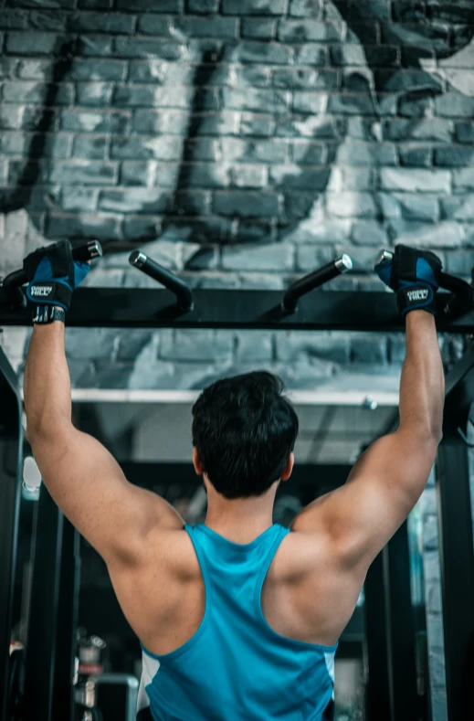 a man lifting a heavy barbell into the air in a gym