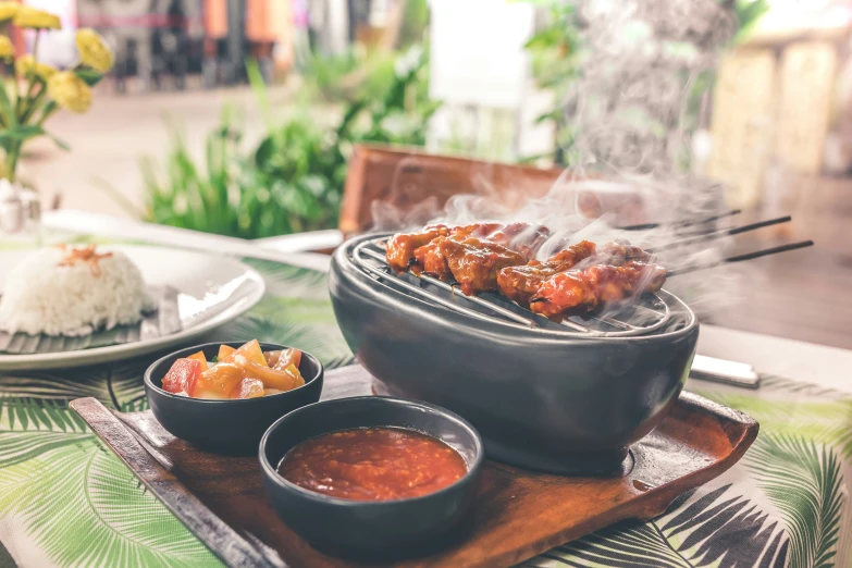 a table topped with bowls filled with food