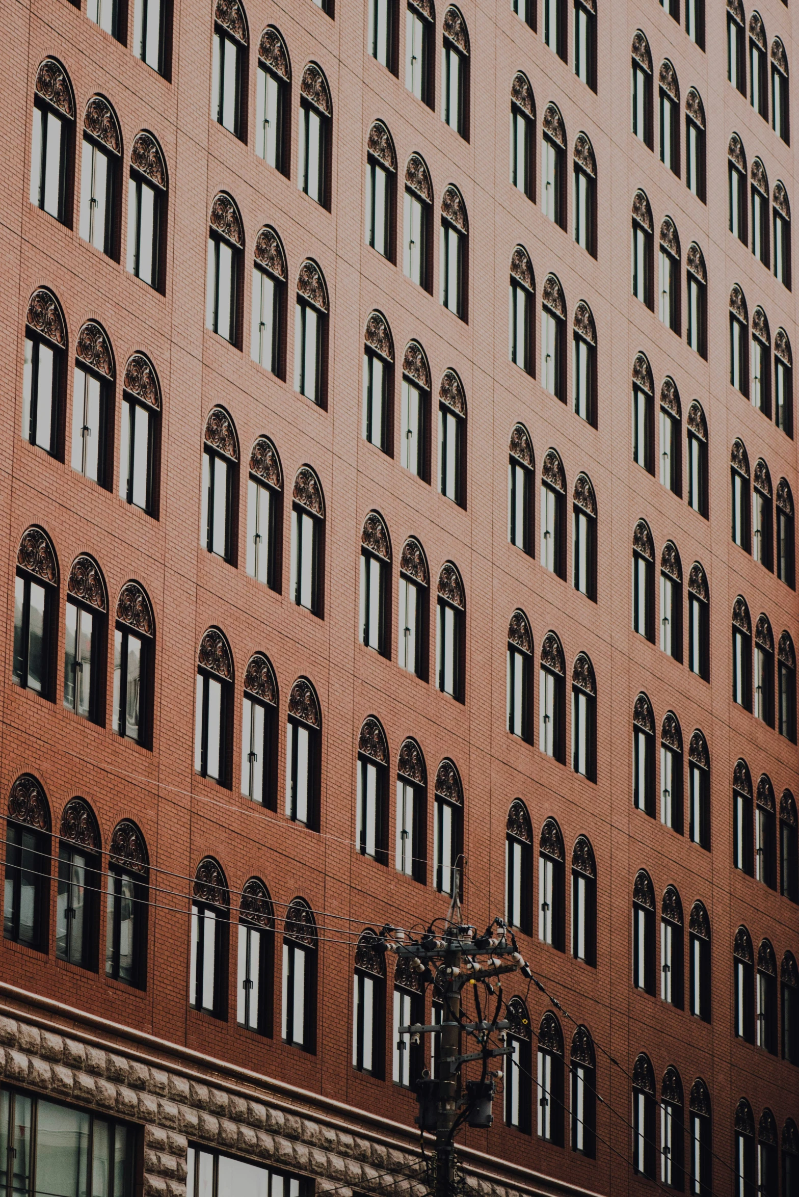 a building that has a street light and several windows