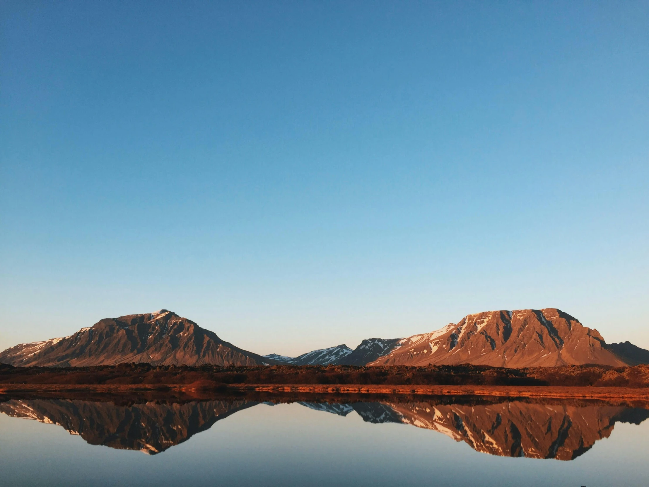 a large body of water surrounded by mountains