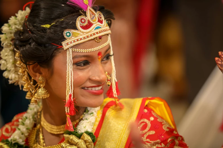 a beautiful woman wearing a red and yellow dress