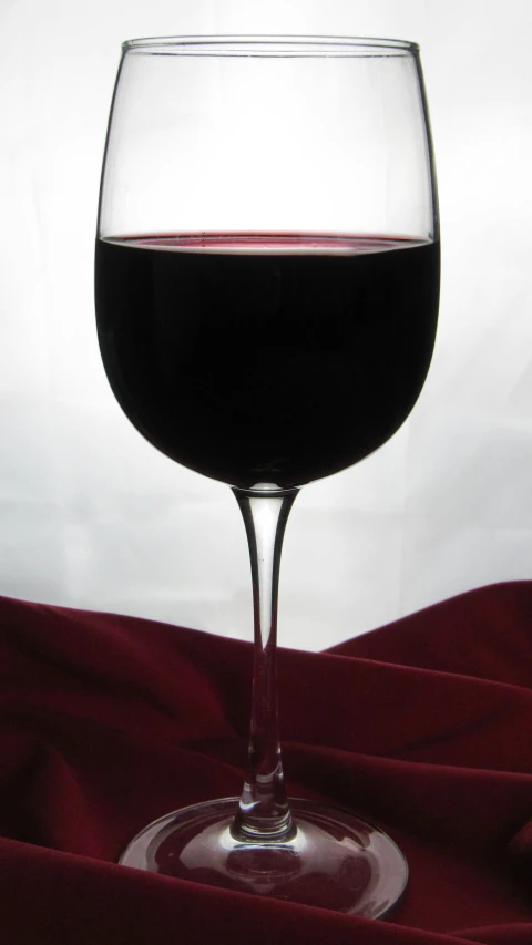 a close up of a wine glass with wine