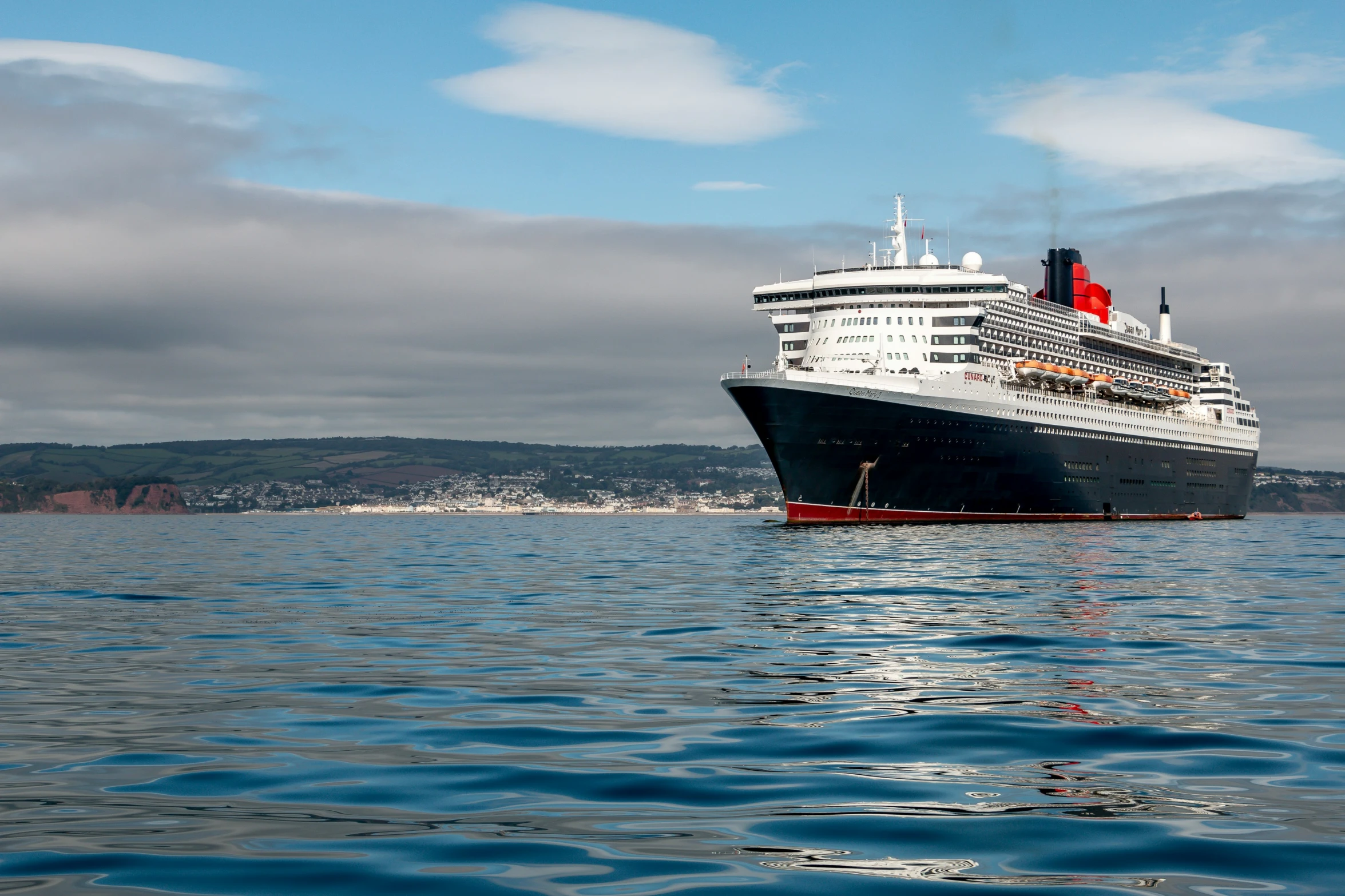 a cruise ship sailing in a body of water