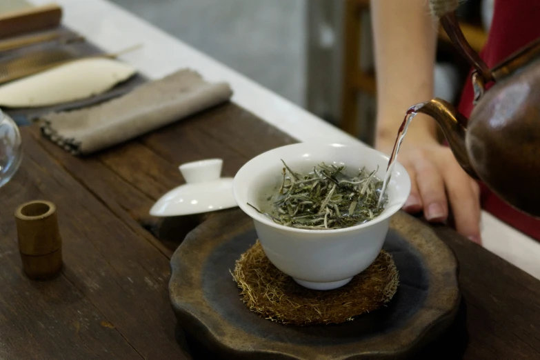 a cup of tea is sitting on a plate