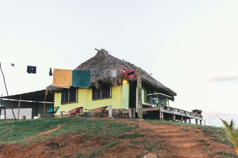 there is a building that has several colored bales on the roof