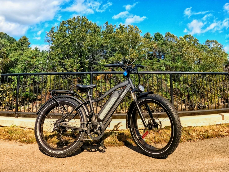 an electric bike in front of a fence