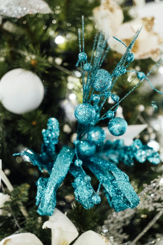 a bunch of ornaments in a small christmas tree