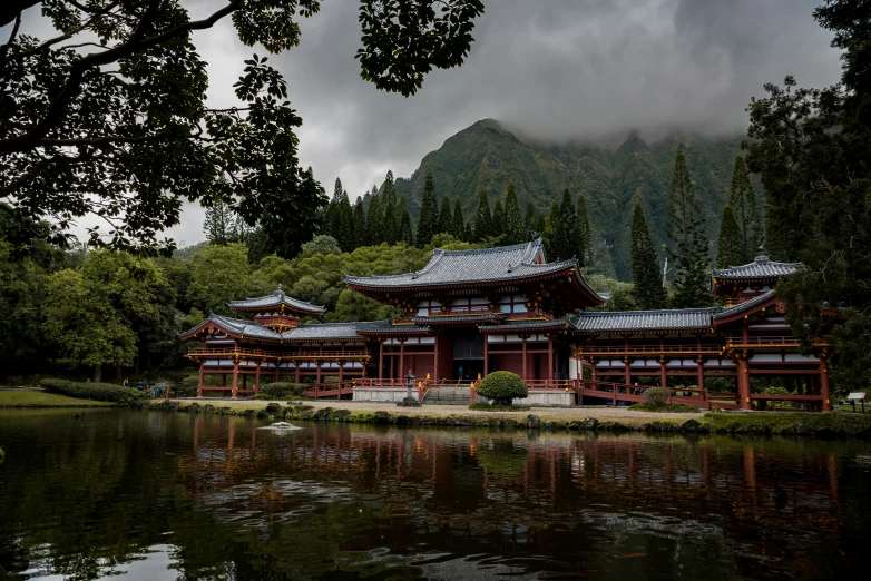 a building with many windows by the water