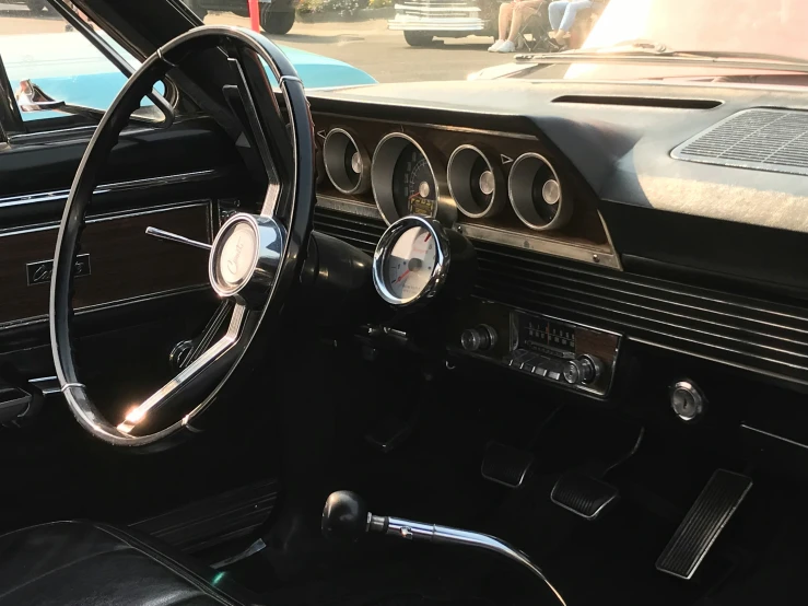 a classic car dashboard with an analog instrument