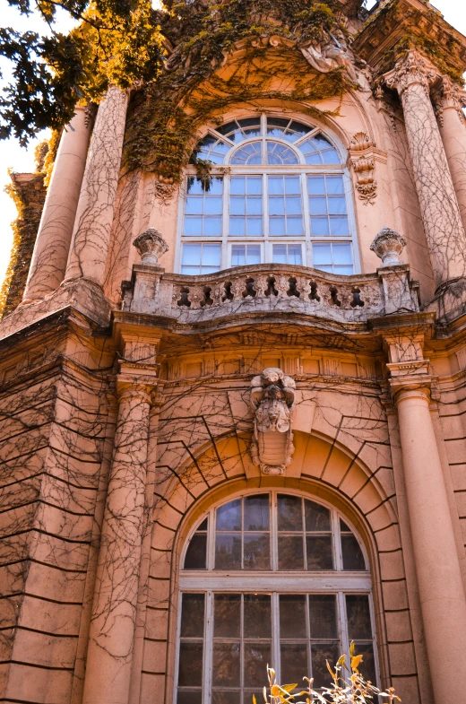 an old building with a tall tower next to a window