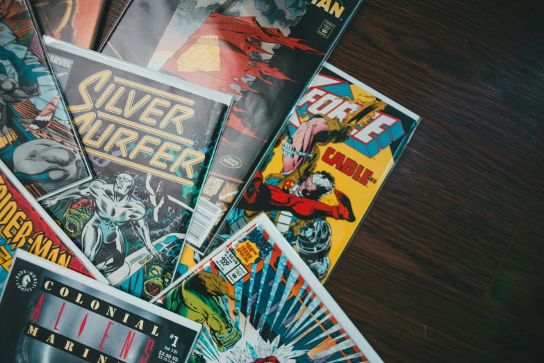 many covers of comics are on the table