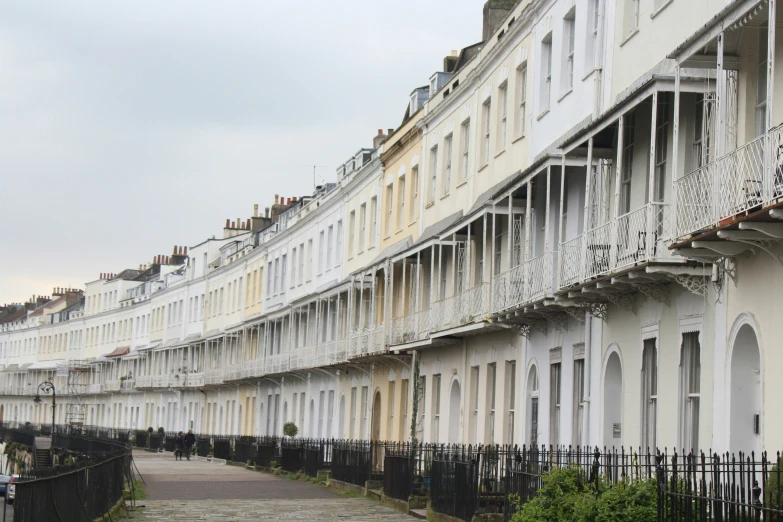 several row houses and balconies on a city street