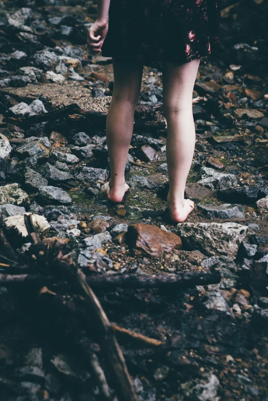 two people walking down a rocky path together