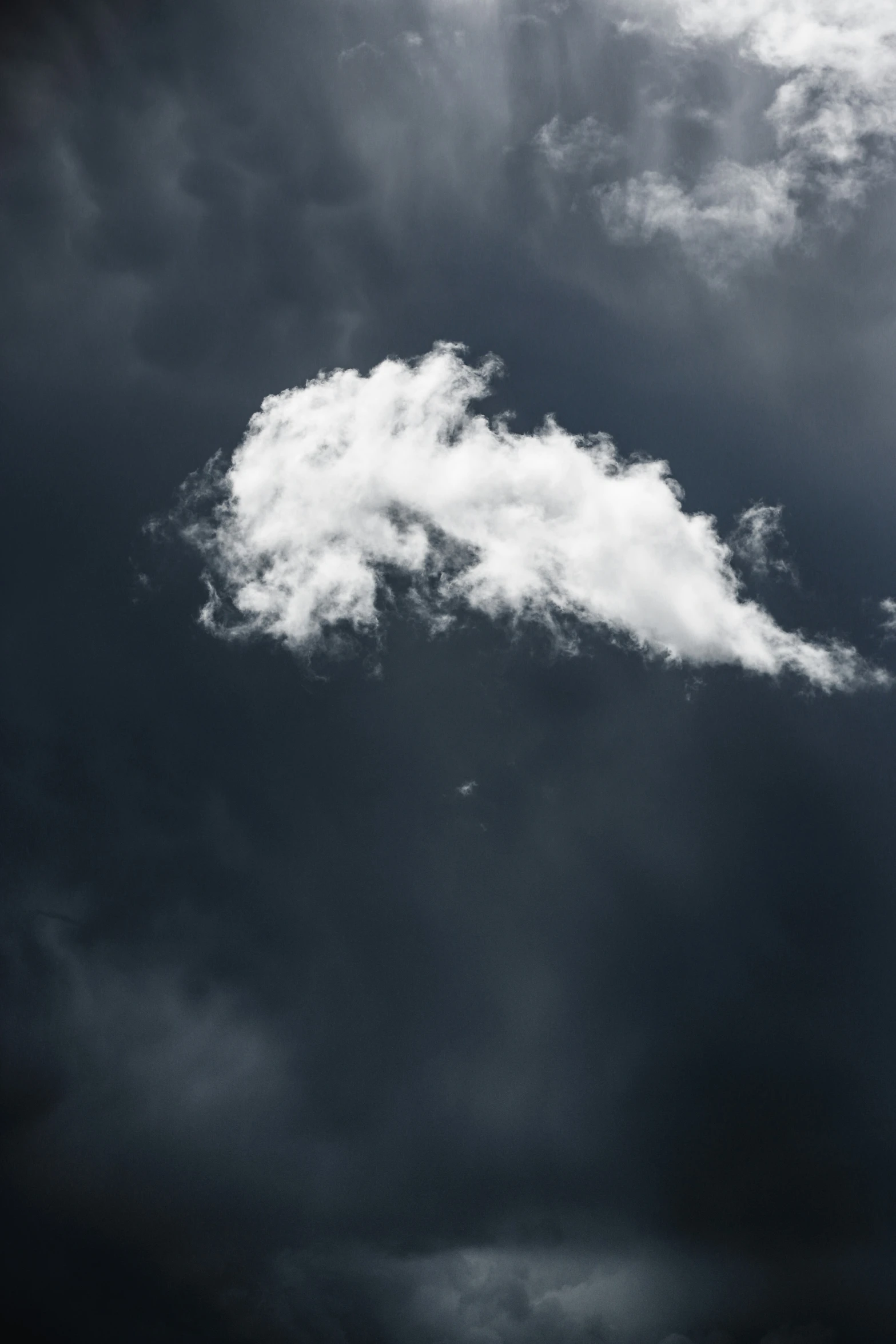 a jetliner flying through a cloudy sky