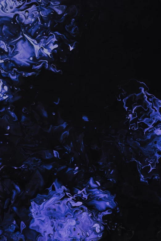 blue swirled substance is shown in the dark