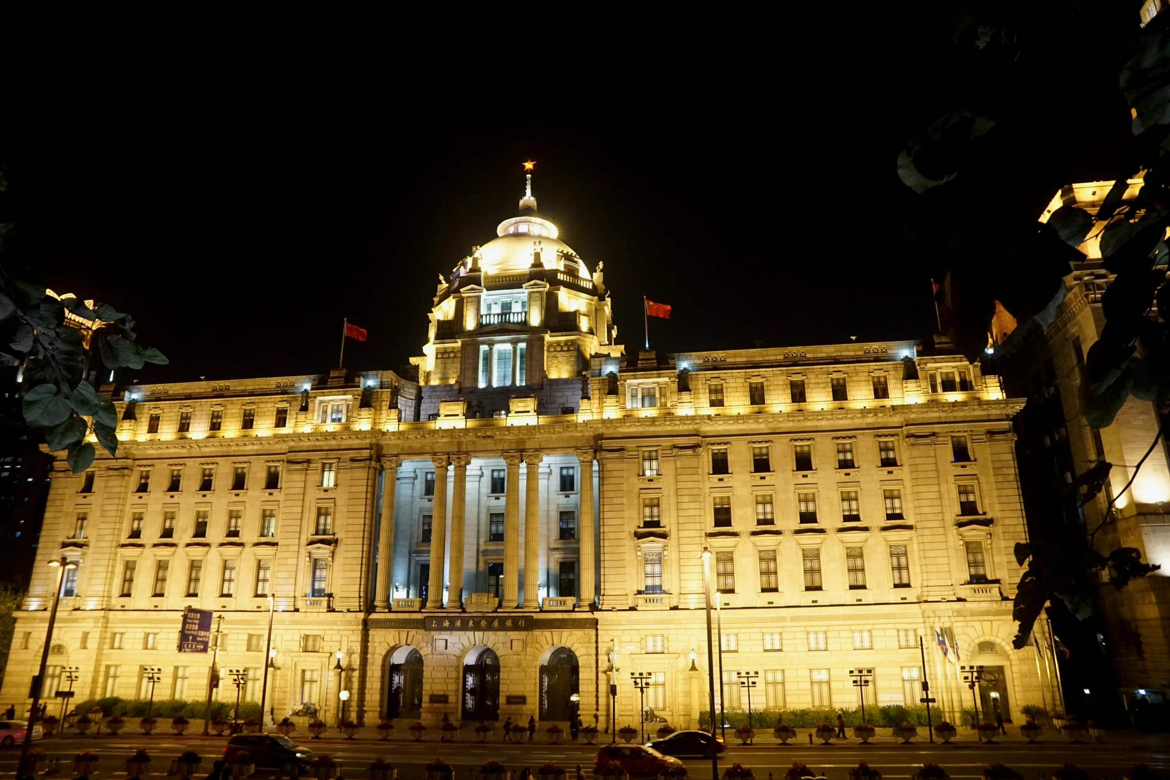 an old fashioned building lit up at night