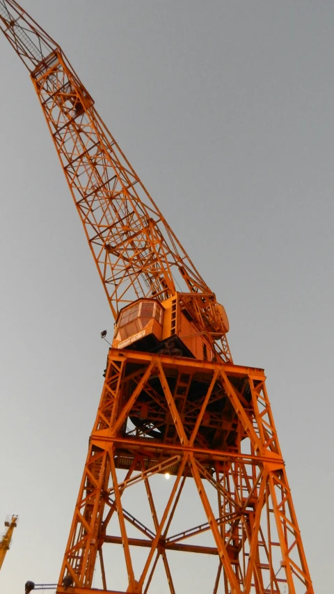 a red crane is in the middle of a building