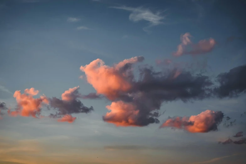 the sky is blue and pink with some clouds