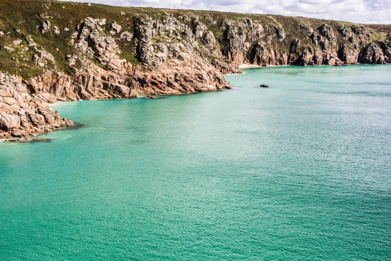 a big body of water with a green and blue surface