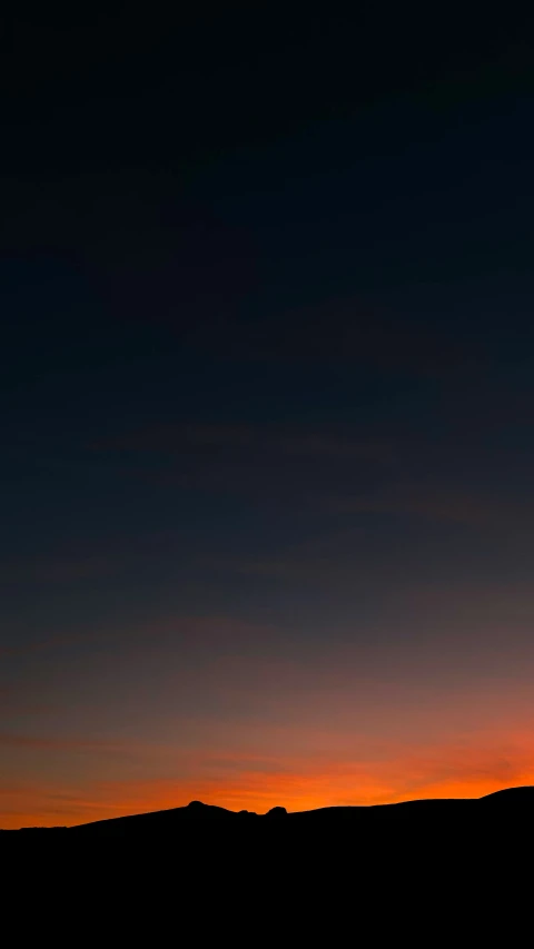 the silhouette of a person with a ski board