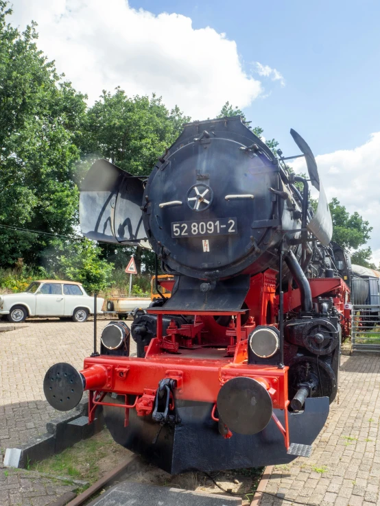 an old train is sitting outside on the ground