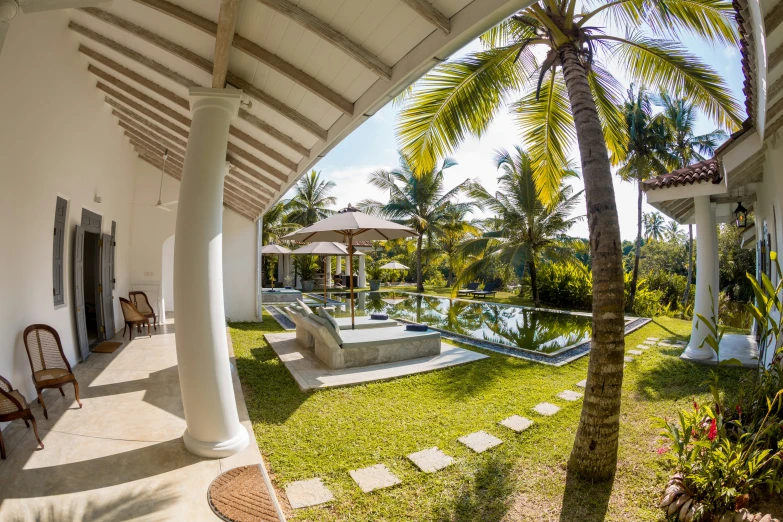 an interior patio area with a pool and water features