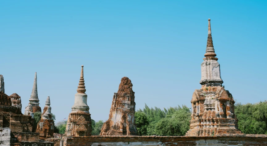 a row of ancient buildings on a clear day