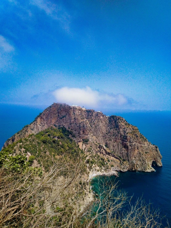 a very small hill by the ocean