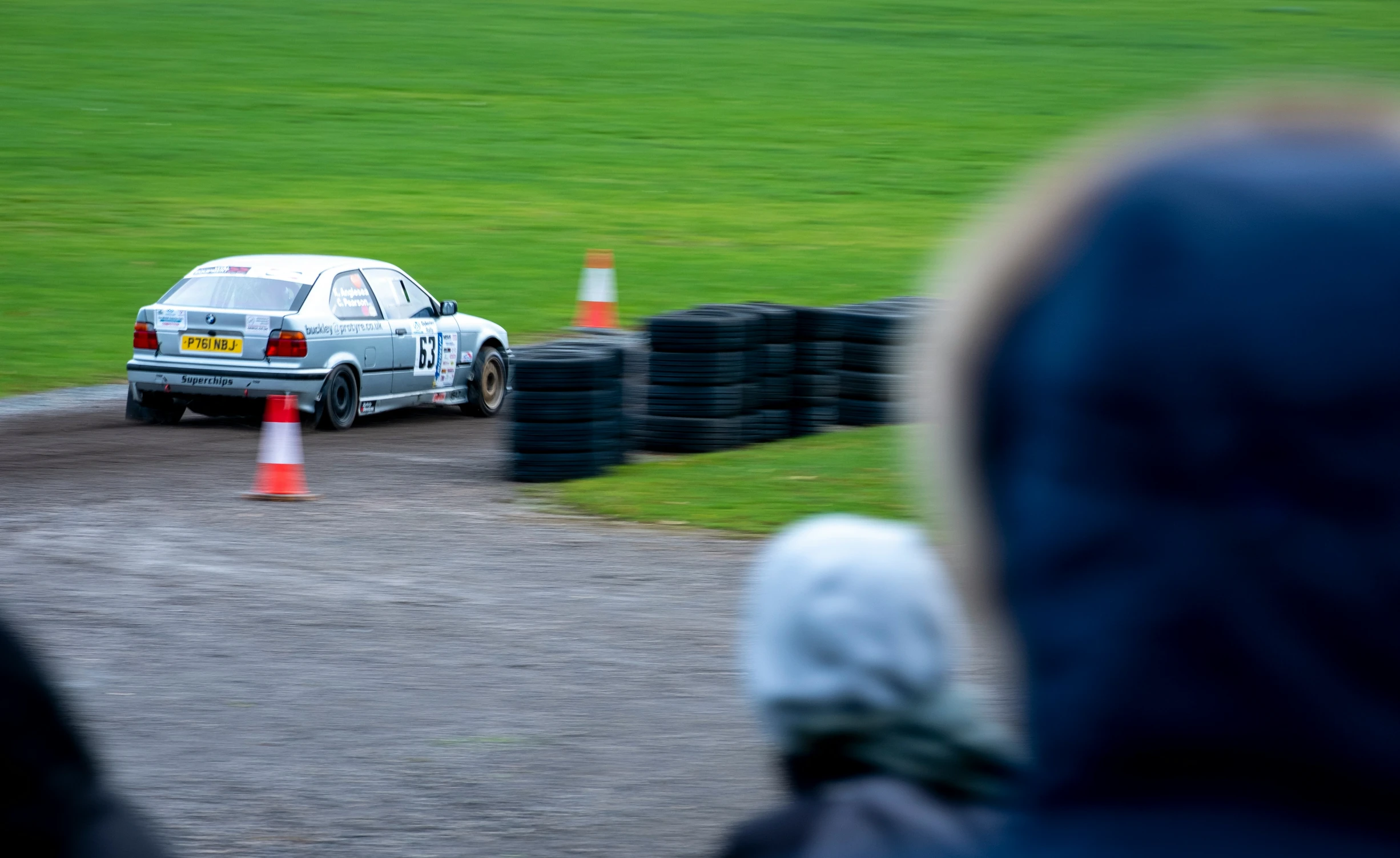 a car is on a track with cones around it