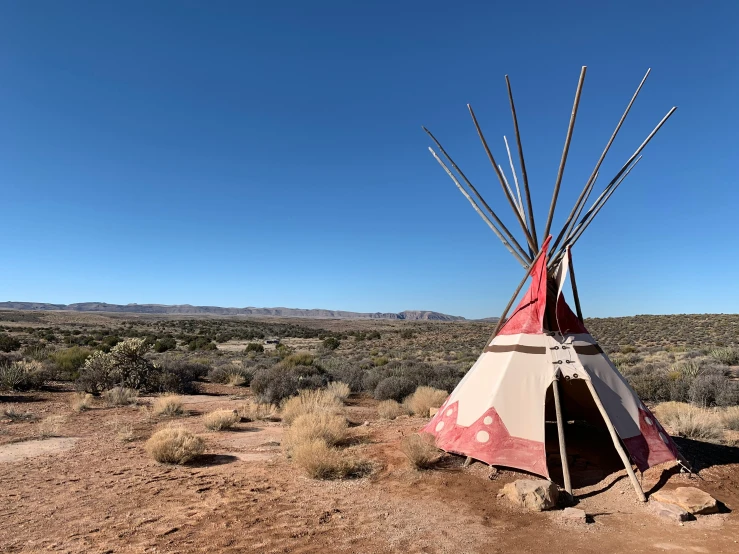 a teepee in the middle of nowhere in the desert