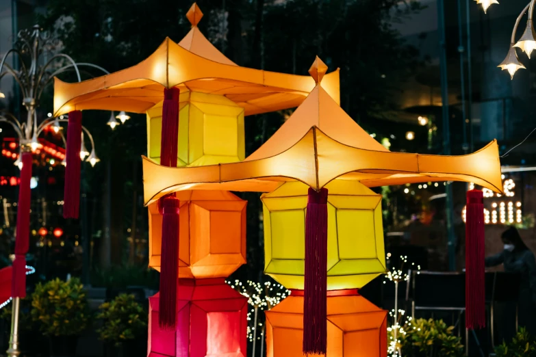 a night view shows bright lights and colorful lanterns