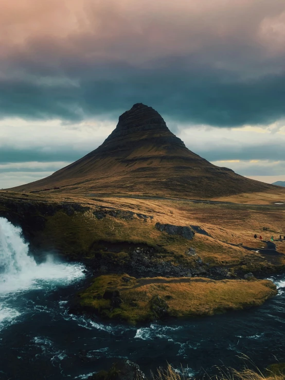 the top of a mountain on an overcast day