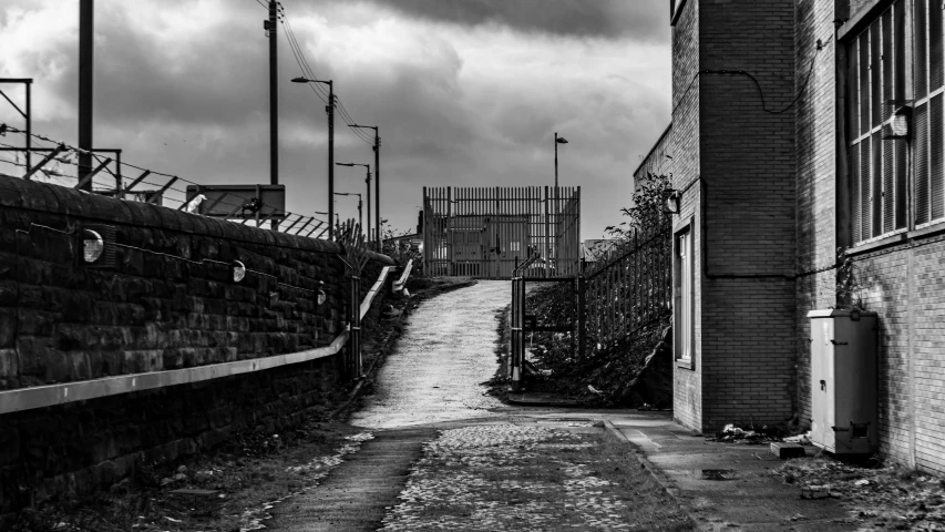 the cobblestone path leading up to the gated area