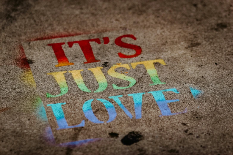 this is a graffiti on the street that reads, it's just love