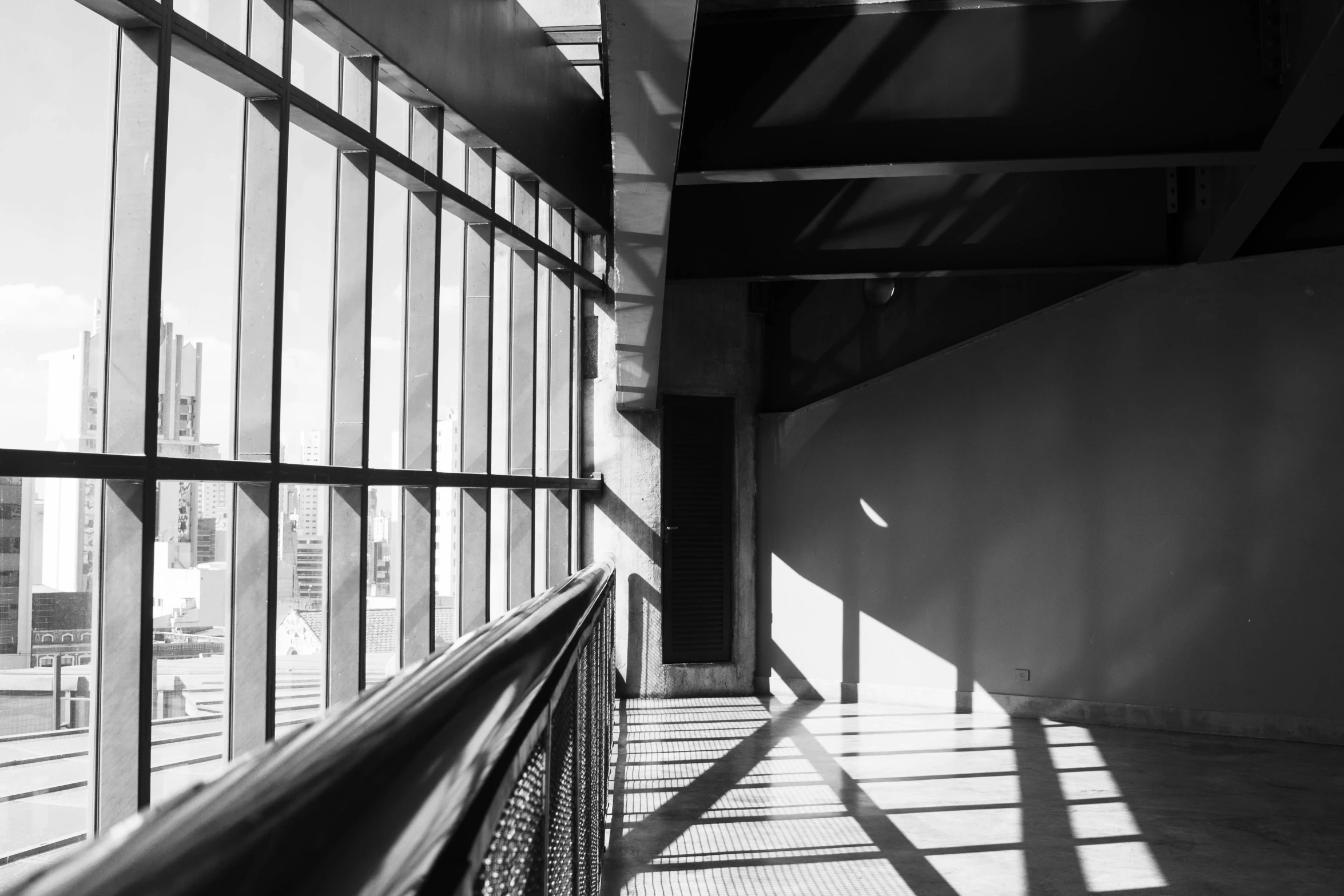 a black and white image of a balcony