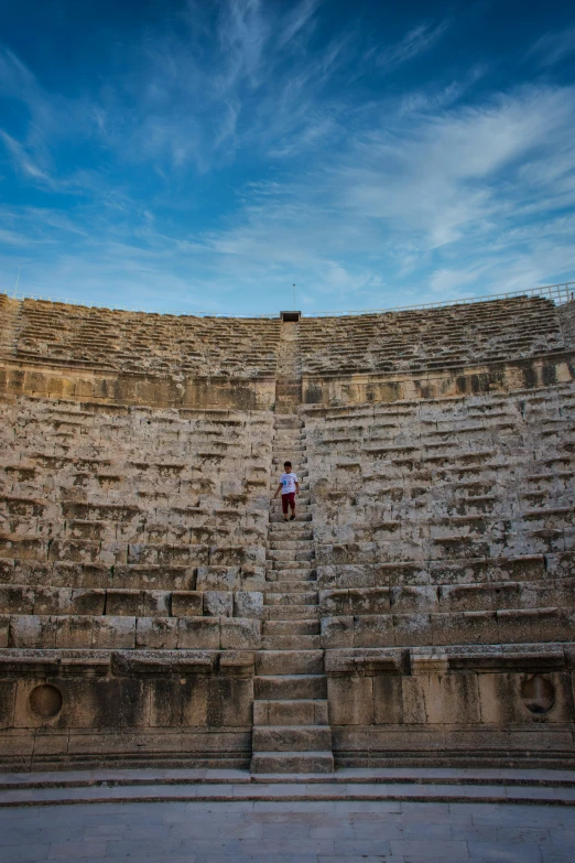 a bunch of stone wall sections in front of someone on the stairs